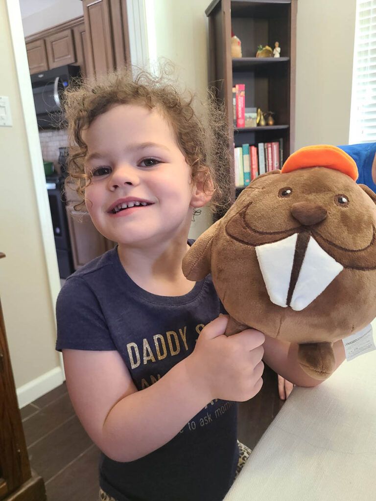 Child with a stuffed beaver