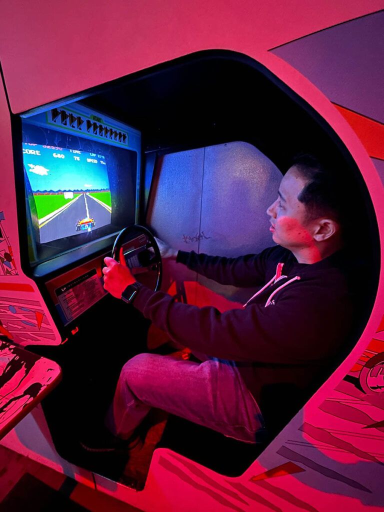 Anthony playing a driving game