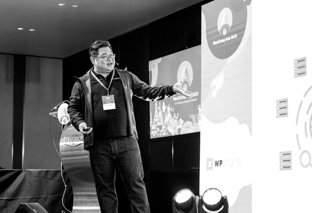 black and white photo of a WordCamp talk
